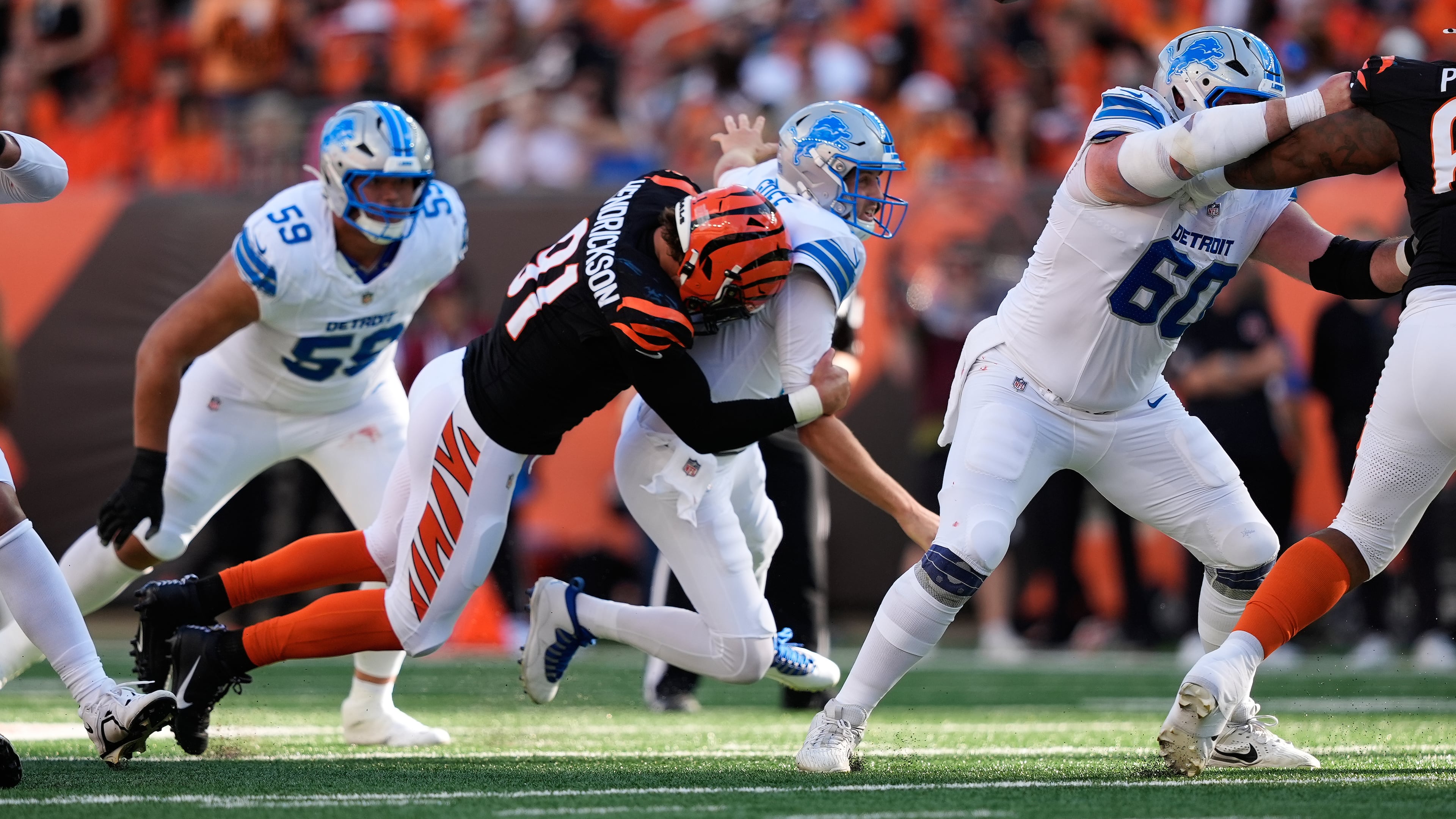 Cincinnati Bengals defensive end Trey Hendrickson (91) causes Detroit Lions quarterback Jared Goff (16) to fumble during the first half of an NFL football game Sunday, Oct. 5, 2025, in Cincinnati. (AP Photo/Carolyn Kaster)