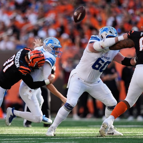 Cincinnati Bengals defensive end Trey Hendrickson (91) causes Detroit Lions quarterback Jared Goff (16) to fumble during the first half of an NFL football game Sunday, Oct. 5, 2025, in Cincinnati. (AP Photo/Carolyn Kaster)