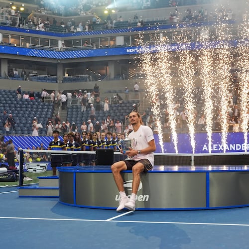 Alexander Zverev, of Germany, holds his trophy after winning the men's singles final of the U.S. Open tennis championships against Ben Shelton, of the United States, Sunday, Sept. 13, 2026, in New York. (AP Photo/Frank Franklin II)