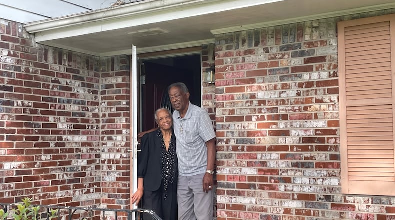 Dorothy and Oscar Wilson at the door of their Morrow home. The bank foreclosed on them for being $1,062.45 behind.