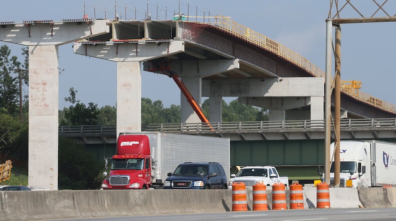 Construction is ongoing for the Northwest Corridor express lane project, which will add 29.7 miles of reversible toll lanes in the I-75/I-575 corridor. BOB ANDRES/BANDRES@AJC.COM