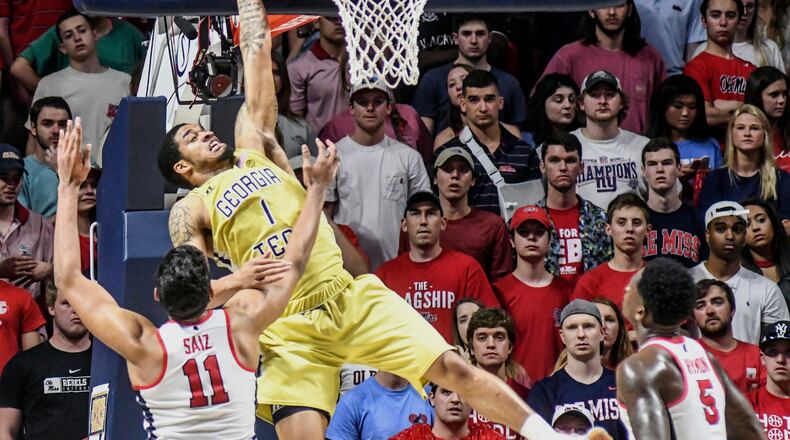 Georgia Tech guard Tadric Jackson (1) misses on a dunk attempt as Mississippi forward Sebastian Saiz (11) defends as Mississippi forward Marcanvis Hymon (5) looks on during an NCAA college basketball game in the quarterfinals of the NIT on Tuesday, March 21, 2017, in Oxford, Miss. (Bruce Newman/The Oxford Eagle via AP)