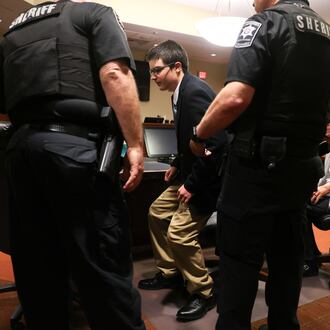 Colt Gray, the 16-year-old Apalachee High School shooter, stands to be handcuffed following his sentencing at Barrow County Superior Court in Winder on July 28, 2026. He received life without parole. (Arvin Temkar/AJC)