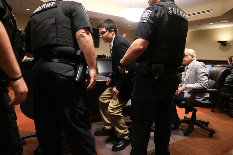 Colt Gray, the 16-year-old Apalachee High School shooter, stands to be handcuffed following his sentencing at Barrow County Superior Court in Winder on July 28, 2026. He received life without parole. (Arvin Temkar/AJC)