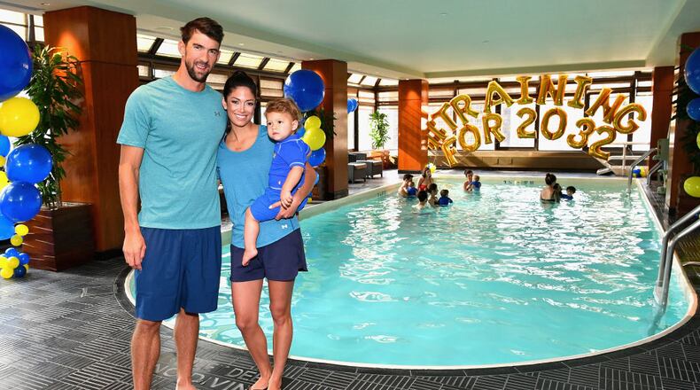 NEW YORK, NY - AUGUST 21: Michael Phelps, Nicole Phelps and Boomer Phelps attendthe Huggies Little Swimmers #trainingfor2032 Swim Class With The Phelps Foundation on August 21, 2017 in New York City. (Photo by Dia Dipasupil/Getty Images for Huggies)