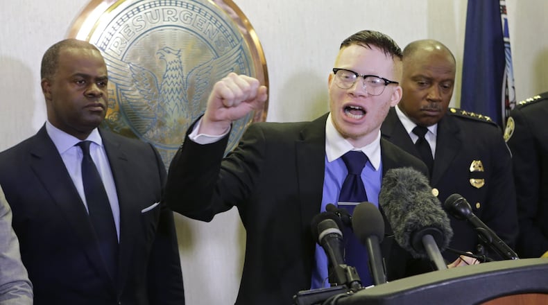 Atlanta Mayor Kasim Reed (left) and Police Chief George Turner stand by as President of the Greater Atlanta Black Lives Matter, Sir Maejor, was given a chance to speak at a press briefing after Reed met with Black Lives matters protesters on July 18. (AJC File Photo BOB ANDRES / BANDRES@AJC.COM)