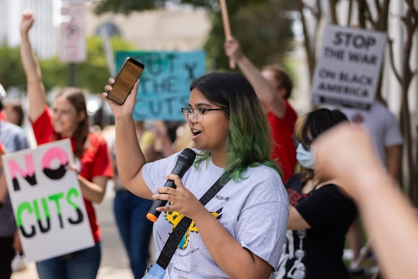 Third-year student Simran Mohanty said students who are new to campus will struggle to find resources that she and other students value. “KSU moved the women’s resource center into a building with barely any foot traffic, claiming it gives them more space,” Mohanty told the crowd. “But what good is space if no one can find it?” (Arvin Temkar/AJC)