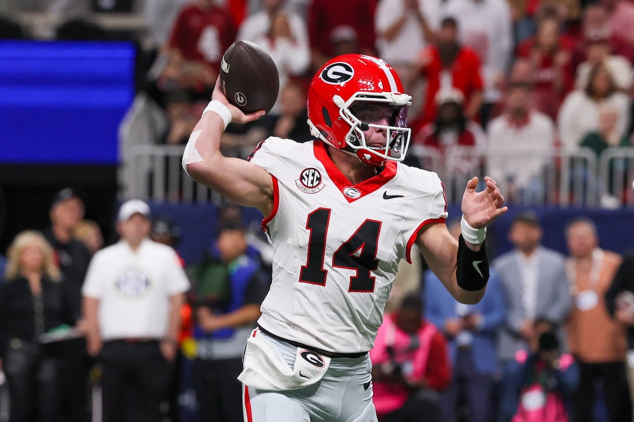 Georgia quarterback Gunner Stockton throws his first touchdown to Roderick Robinson II (not pictured) against Alabama during the first quarter of the SEC Championship game at Mercedes-Benz Stadium, Saturday, Dec. 6, 2025, in Atlanta. (Jason Getz/AJC)