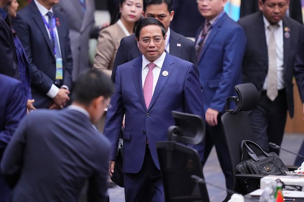 Vietnam's Prime Minister Pham Minh Chinh, center, arrives to attend the plenary session at the Association of Southeast Asian Nations (ASEAN) Summit in Kuala Lumpur, Malaysia, Monday, May 26, 2025. (AP Photo/Vincent Thian)