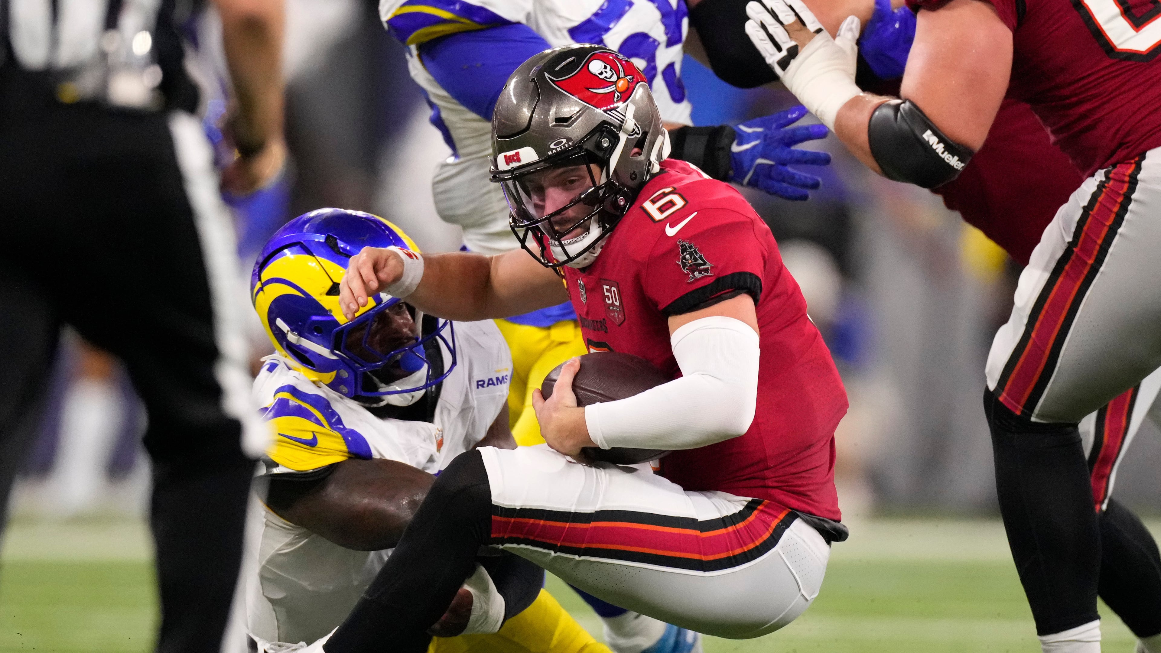Los Angeles Rams linebacker Jared Verse tackles Tampa Bay Buccaneers quarterback Baker Mayfield during the first half of an NFL football game, Sunday, Nov. 23, 2025, in Inglewood, Calif. (AP Photo/Mark J. Terrill)