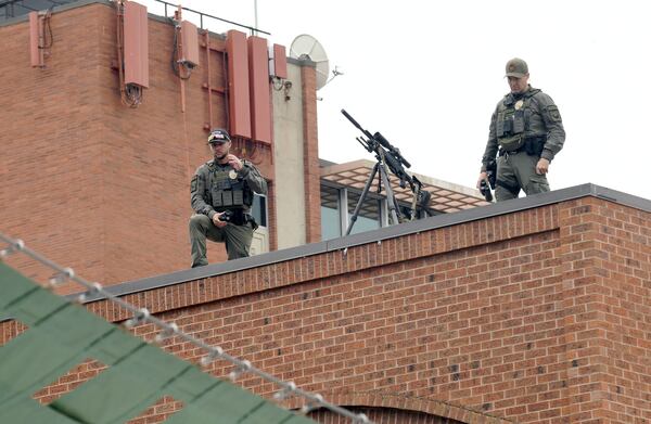 Law enforcement officers keep watch from a rooftop overlooking the Boulder Jewish Festival in Boulder, Colo., on Sunday, June 8, 2025. (AP Photo/Thomas Peipert)