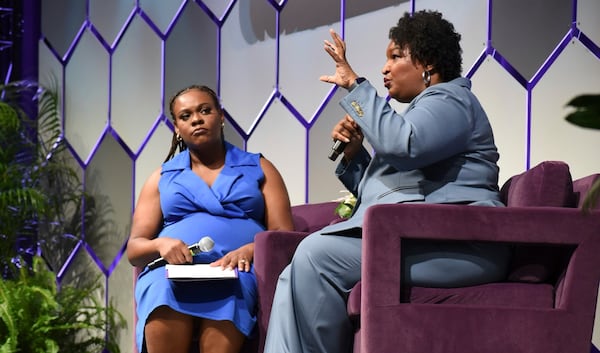 Two-time Georgia gubernatorial candidate and voting rights activist Stacey Abrams, right, sits next to Arekia Bennett-Scott, the executive director of Mississippi Votes, at the 2025 Democracy in Action Convening in Jackson, Miss., Saturday, June 28, 2025. (AP Photo/Sophie Bates)