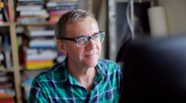 Randy Osborne, at work  in his home office in Atlanta,  went to live with his grandparents after his father left, and then his grandfather left.