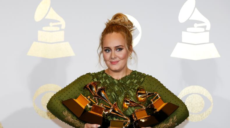 Adele and her armload of Grammys. (Allen J. Schaben/Los Angeles Times/TNS)