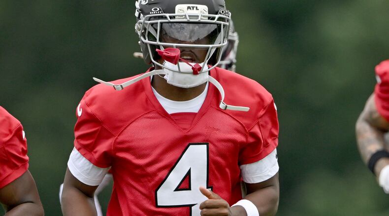 Atlanta Falcons wide receiver Jahan Dotson warms up during an OTA workout at the Atlanta Falcons Training Facility in May. (Hyosub Shin/AJC)