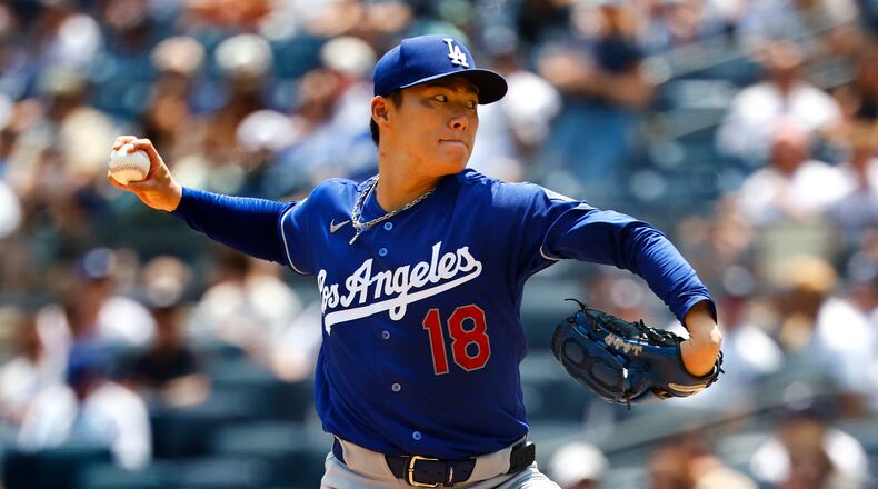 Los Angeles Dodgers' Yoshinobu Yamamoto delivers during the first inning of the first game of a baseball doubleheader against the New York Yankees, Sunday, July 19, 2026, in New York. (AP Photo/Noah K. Murray)
