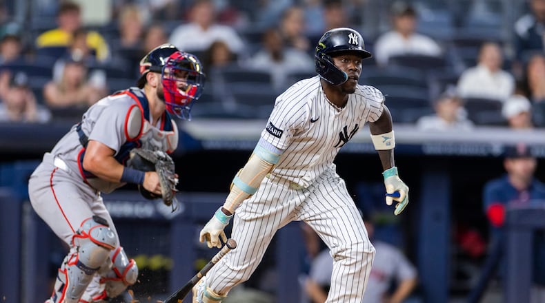 New York Yankees' Jazz Chisholm Jr., right, watches after he hit into a fielder's choice in the eighth inning during the second baseball game of a doubleheader against the Boston Red Sox, Saturday, Aug. 29, 2026, in New York. (AP Photo/Corey Sipkin)