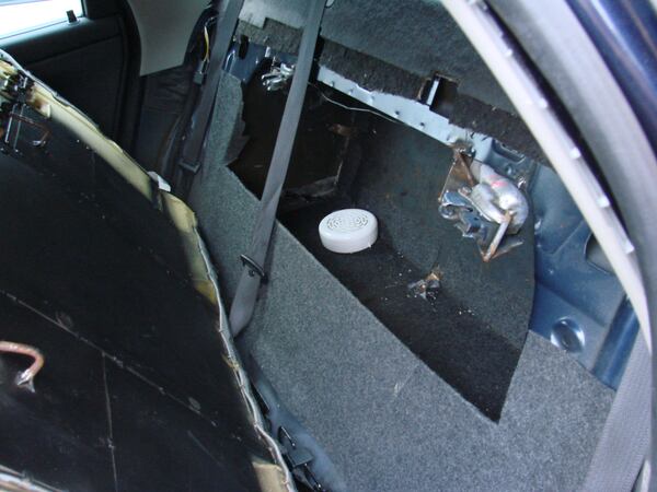 Investigators found a compartment in the man's car that contained 15 pounds of methamphetamine in "various stages of production."