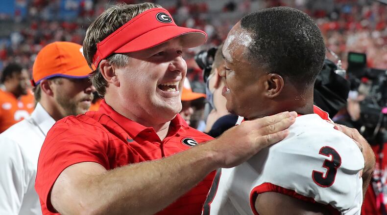 Georgia head coach Kirby Smart and tailback Zamir White celebrate a 10-3 season opening victory over Clemson Saturday, Sept 4, 2021, in Charlotte, N.C. (Curtis Compton / Curtis.Compton@ajc.com)