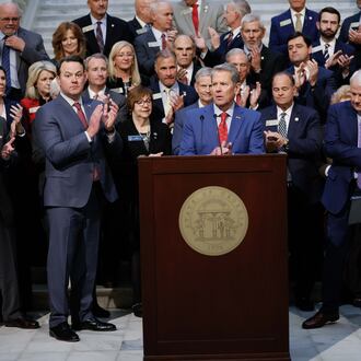 Lt. Gov. Burt Jones (from left), Gov. Brian Kemp, Speaker of the House Jon Burns and Insurance Commissioner John King applaud during a news conference related to Medicaid on Wednesday, Jan. 15, 2025, at the state Capitol in Atlanta. (Miguel Martinez/AJC)