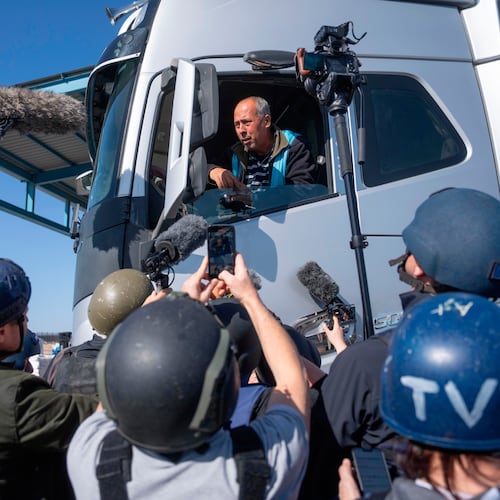 FILE - A truck driver picks up humanitarian aid designated for Gaza, as reporters tour the Palestinian side of the Kerem Shalom crossing where aid is awaiting pickup, on Dec. 19, 2024. (AP Photo/Ohad Zwigenberg, File)