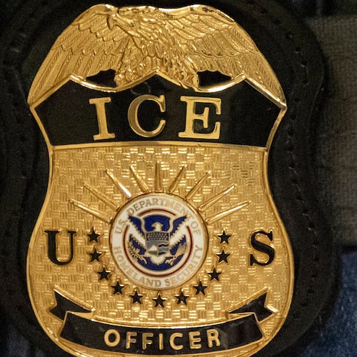 FILE - A federal agent wears an Immigration and Customs Enforcement badge, June 10, 2025, in New York. (AP Photo/Yuki Iwamura, File)