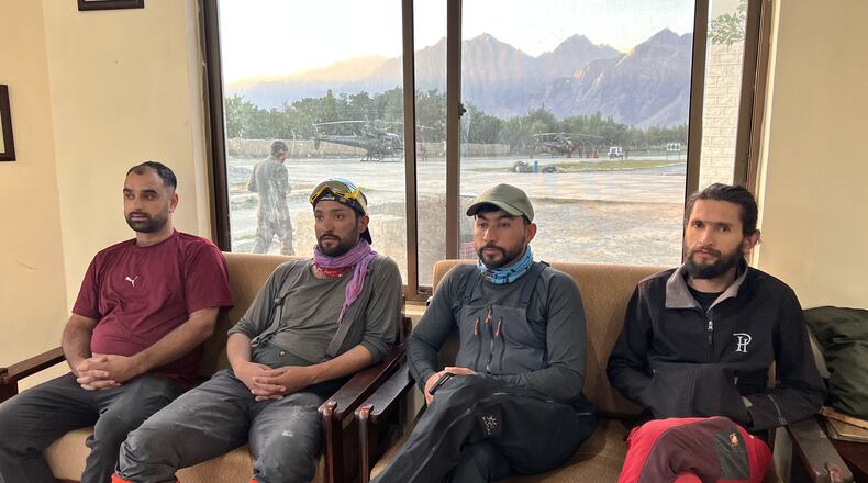 In this photo released by the Alpine Club of Pakistan on Friday, July 31, 2026, members of a mountaineers rescue team prepare to depart from an airbase on a search operation for climbers missing after an avalanche on Pakistan's Broad Peak, in Skardu, in Gilgit-Baltistan's region, in northern Pakistan. (Alpine Club of Pakistan via AP)
