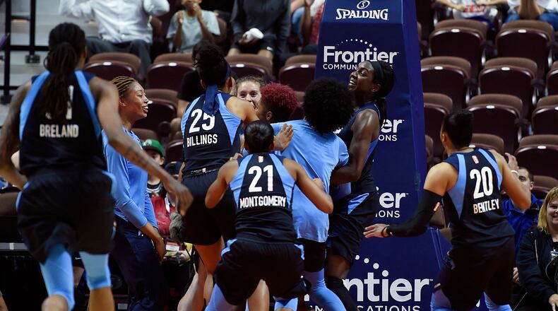 Tiffany Hayes gets mobbed by her Atlanta teammates after sinking a 50-foot game-winner.