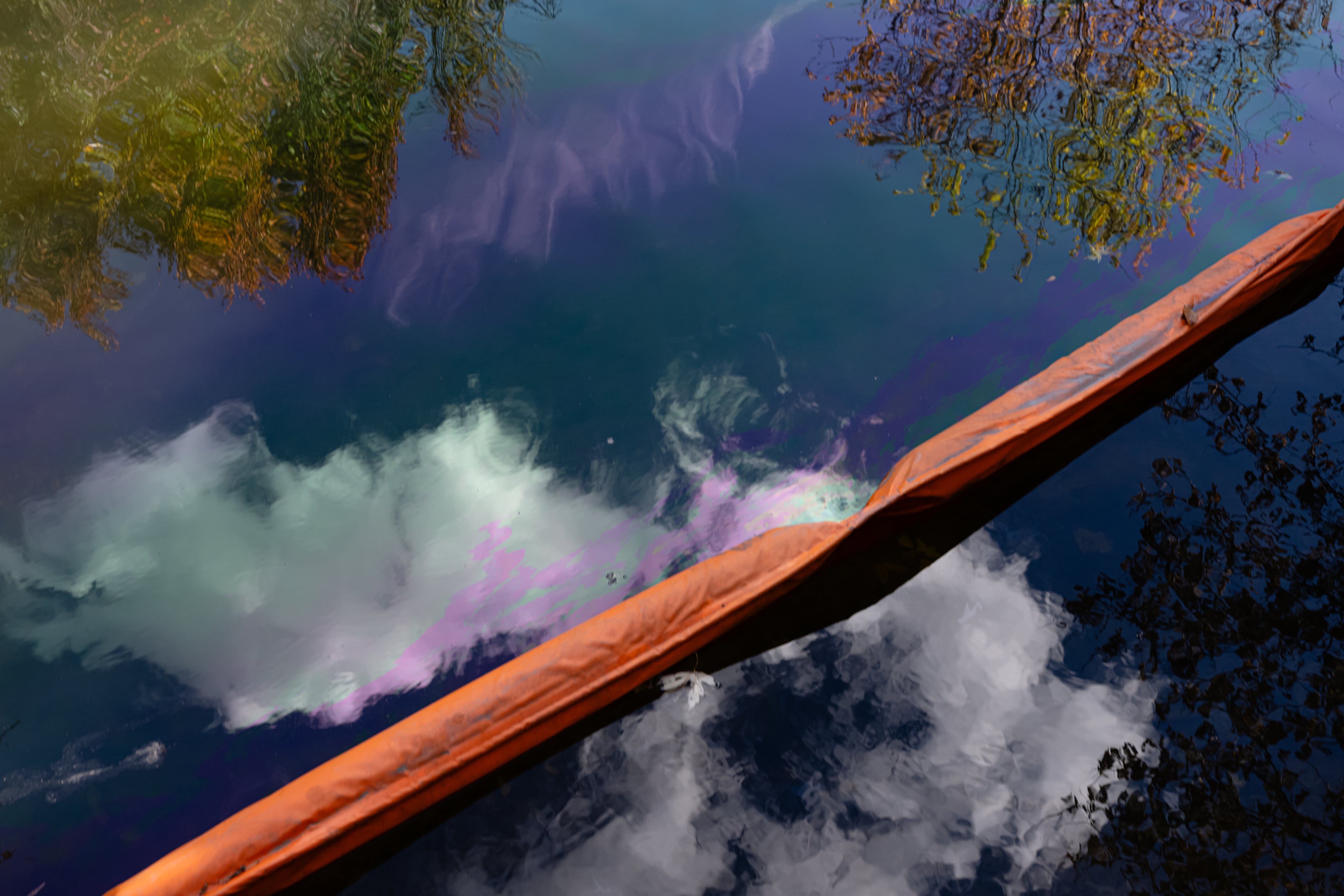 Oil runoff from the UPS plane crash is seen in a waterway known as Northern Ditch on Saturday in Louisville, Kentucky. (Jon Cherry/AP)