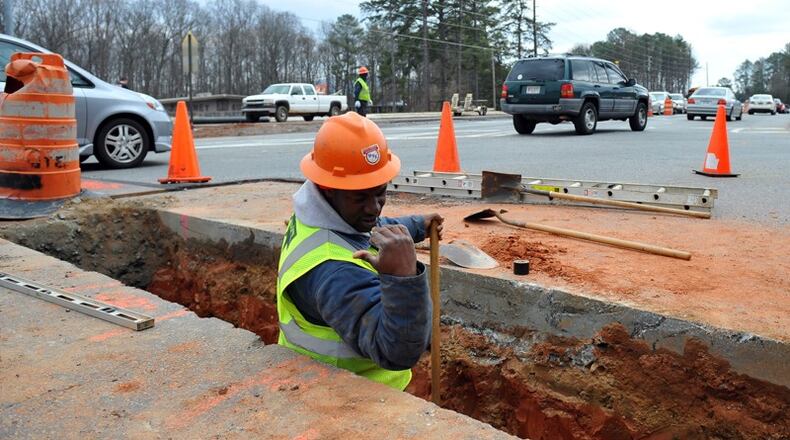 Projects in Powder Springs, receiving $403,135, include mainly water main and sewer installation. AJC file photo