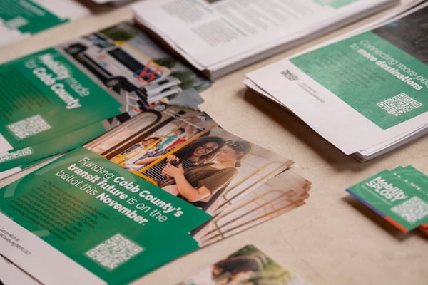 Promotional materials are displayed at a pro-transit campaign kickoff supporting the MSPLOST referendum in Cobb County on Wednesday, Sept. 18, 2024. (Olivia Bowdoin for The Atlanta Journal-Constitution)