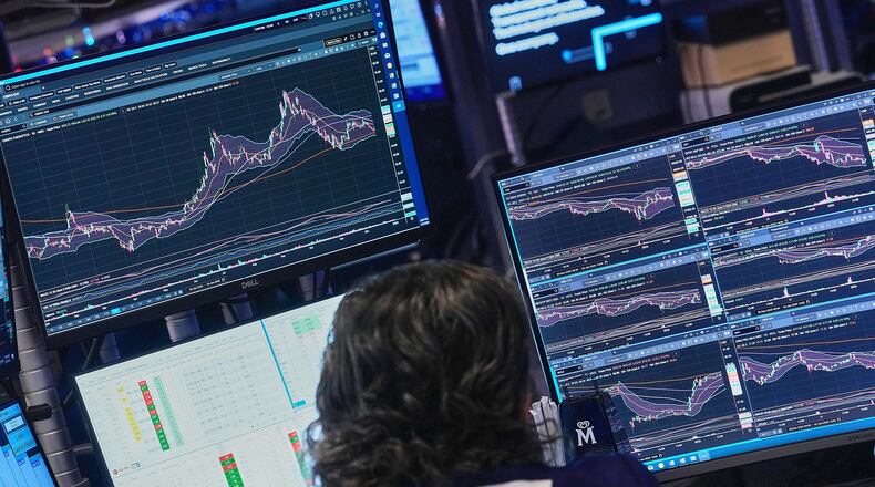 Specialist Michael Pistillo works at his post on the floor of the New York Stock Exchange, Friday, Jan. 2, 2026. (AP Photo/Richard Drew)