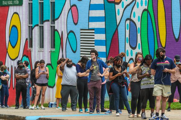 Voters wait to vote at Cross Keys High School in DeKalb County on June 9, 2020. (John Spink/AJC)