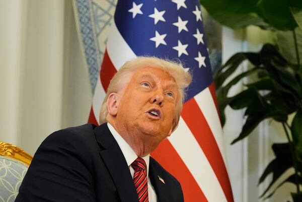 President Donald Trump gestures as meets Qatar's Emir Sheikh Tamim bin Hamad Al Thani at the Amiri Diwan in Doha, Qatar, Wednesday, May 14, 2025. (AP Photo/Alex Brandon)