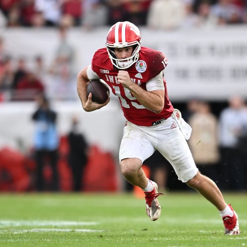 Indiana quarterback Fernando Mendoza (15) rolls out during the second half of the Rose Bowl College Football Playoff quarterfinal game against Alabama Thursday, Jan. 1, 2026, in Pasadena, Calif. (AP Photo/Kyusung Gong)