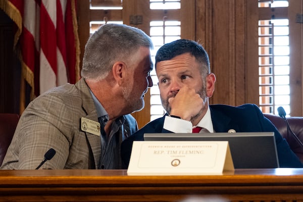 Vice-Chairman Rep. Victor Anderson (R-Cornelia), left, whispers to Chairman Rep. Tim Fleming (R-Covington) during the first meeting of the Georgia House Blue-Ribbon Study Commission on Election Procedures at the State Capitol on Tuesday, July 15, 2025.  (Ben Gray for the AJC)