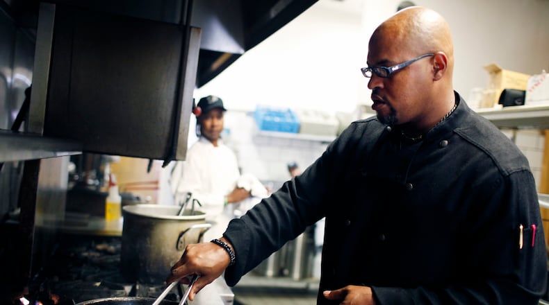 Chef Tony Morrow cooks some shrimp at The Pecan in 2010. / AJC file photo