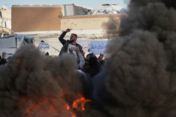 FILE- Palestinians chant slogans during a protest against the war and Hamas in Beit Lahiya, northern Gaza Strip, Wednesday, March 26, 2025, in a rare show of public anger against the militant group that rules the territory. (AP Photo/Jehad Alshrafi, File)
