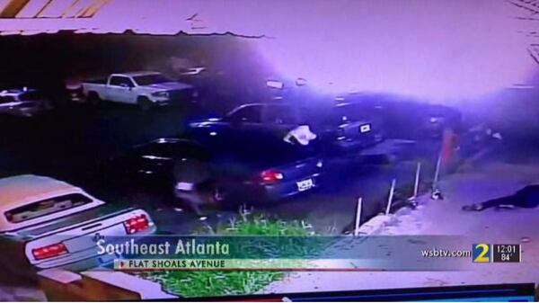 Surveillance footage shows several people diving behind parked cars during a drive-by shooting last Wednesday in East Atlanta Village. 