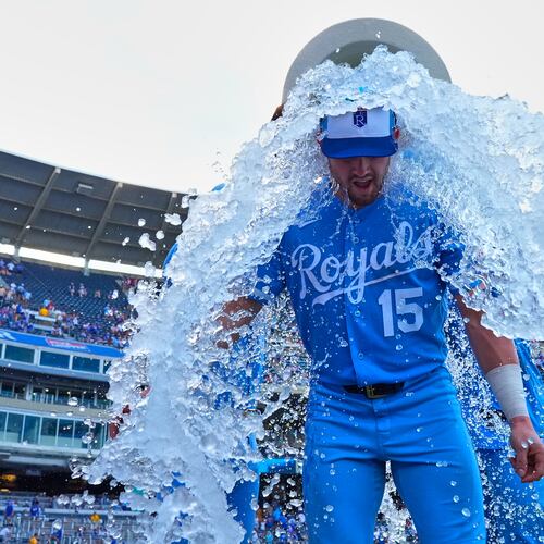 Kansas City Royals' Lane Thomas is doused by teammates after their baseball game against the San Diego Padres, Saturday, July 18, 2026, in Kansas City, Mo. (AP Photo/Charlie Riedel)