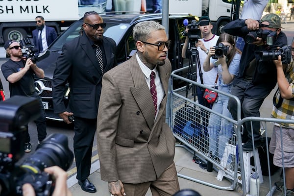 Grammy-winning singer Chris Brown makes his way into Southwark Crown Court, in London, Friday, July 11, 2025.(AP Photo/Alberto Pezzali)