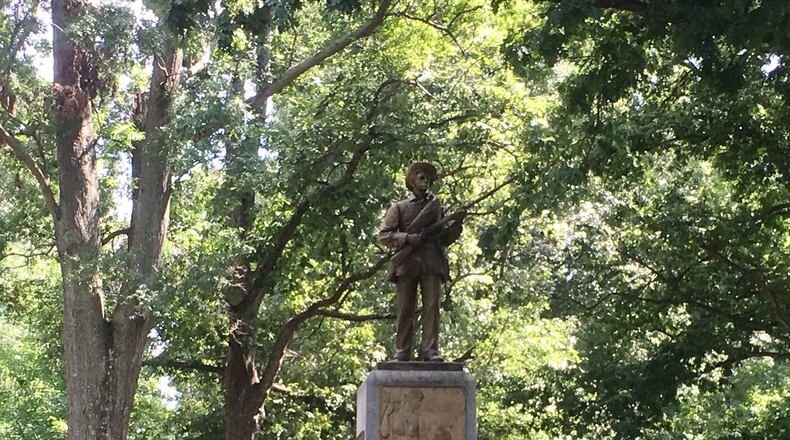 The "Silent Sam" statue on the University of North Carolina campus has been fortified with a double barrier of metal fencing amid protestors' demands it come down. Photo: Jennifer Brett