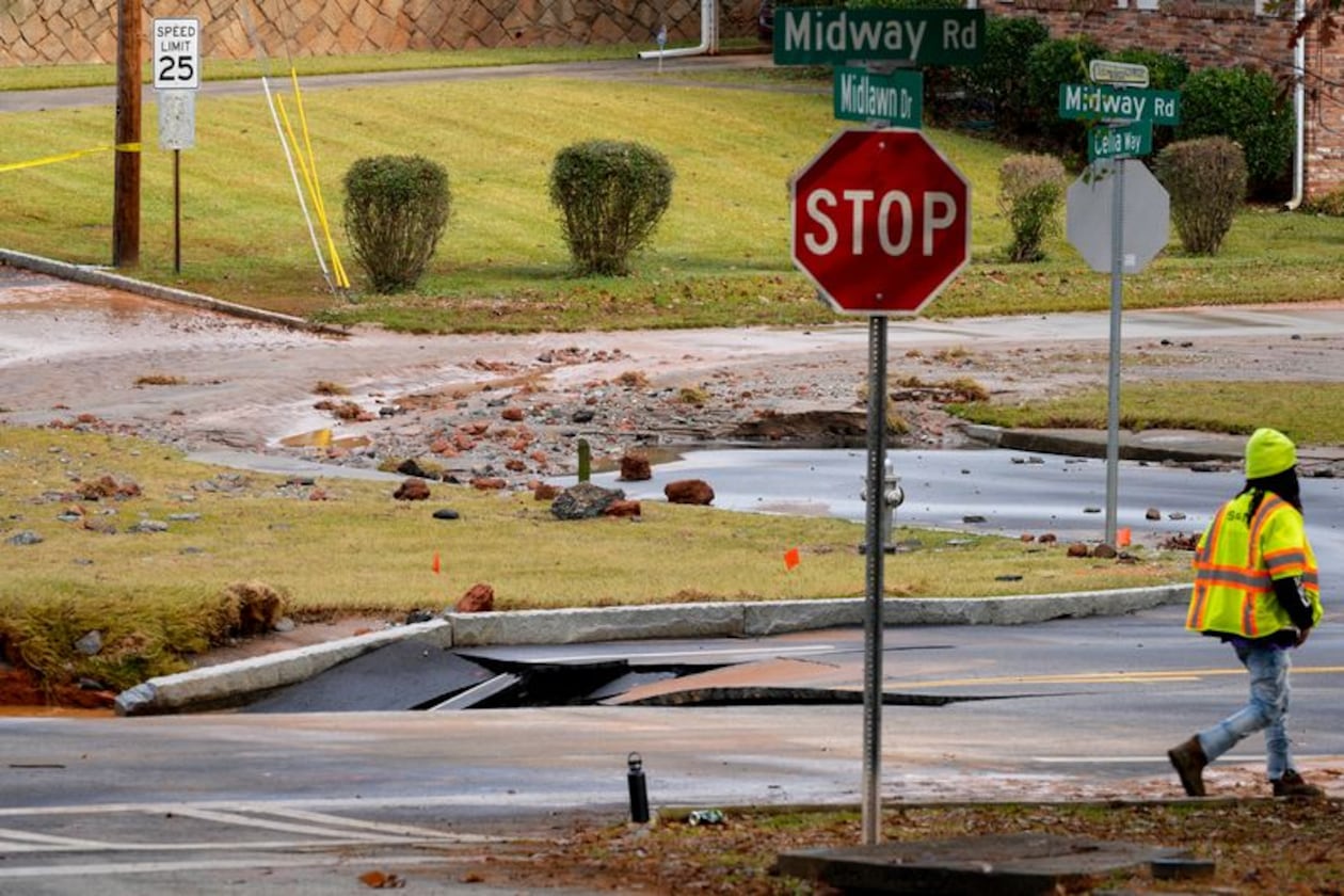 A DeKalb County water main break closed a portion of Midway Road on Monday. The Decatur school district canceled classes. (Ben Hendren for the AJC)