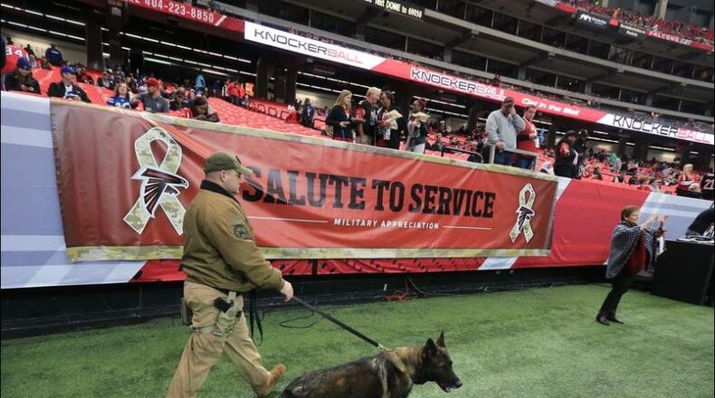 With rumors of terror threats in Atlanta security was increased, including K-9 units searching for possible bombs, for the Falcons and Colts football game at the Georgia Dome on Sunday. CURTIS COMPTON / CCOMPTON@AJC.COM