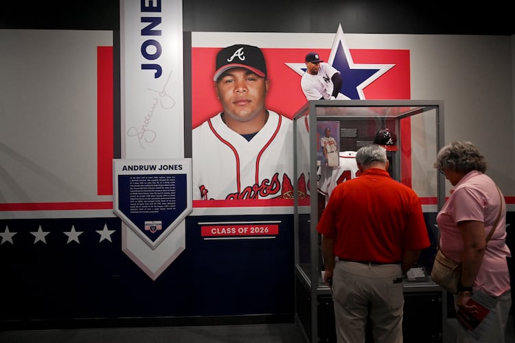 Baseball fans check out displays featuring former Atlanta Braves center fielder Andruw Jones at the National Baseball Hall of Fame and Museum on Friday, July 24, 2026, in Cooperstown, N.Y. (Hyosub Shin/AJC)