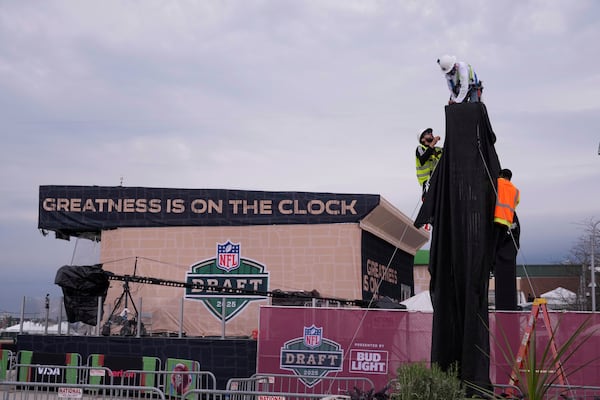 Workers prepare the venue ahead of the NFL football draft Wednesday, April 23, 2025, in Green Bay, Wis. (AP Photo/Jeff Roberson)