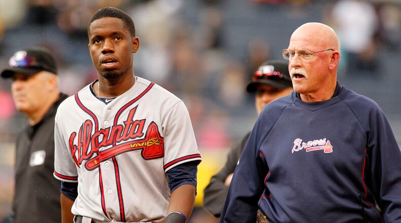 PITTSBURGH, PA - JUNE 28: Eury Perez #14 of the Atlanta Braves walks off the field with medical staff after colliding in the outfield in the ninth inning during the game against the Pittsburgh Pirates at PNC Park on June 28, 2015 in Pittsburgh, Pennsylvania. (Photo by Justin K. Aller/Getty Images)
