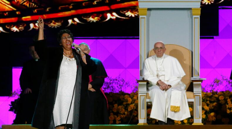 American singer Aretha Franklin sings as Pope Francis and others listen during the World Meeting of Families festival in Philadelphia, Saturday, Sept. 26, 2015. (Tony Gentile/Pool Photo via AP)