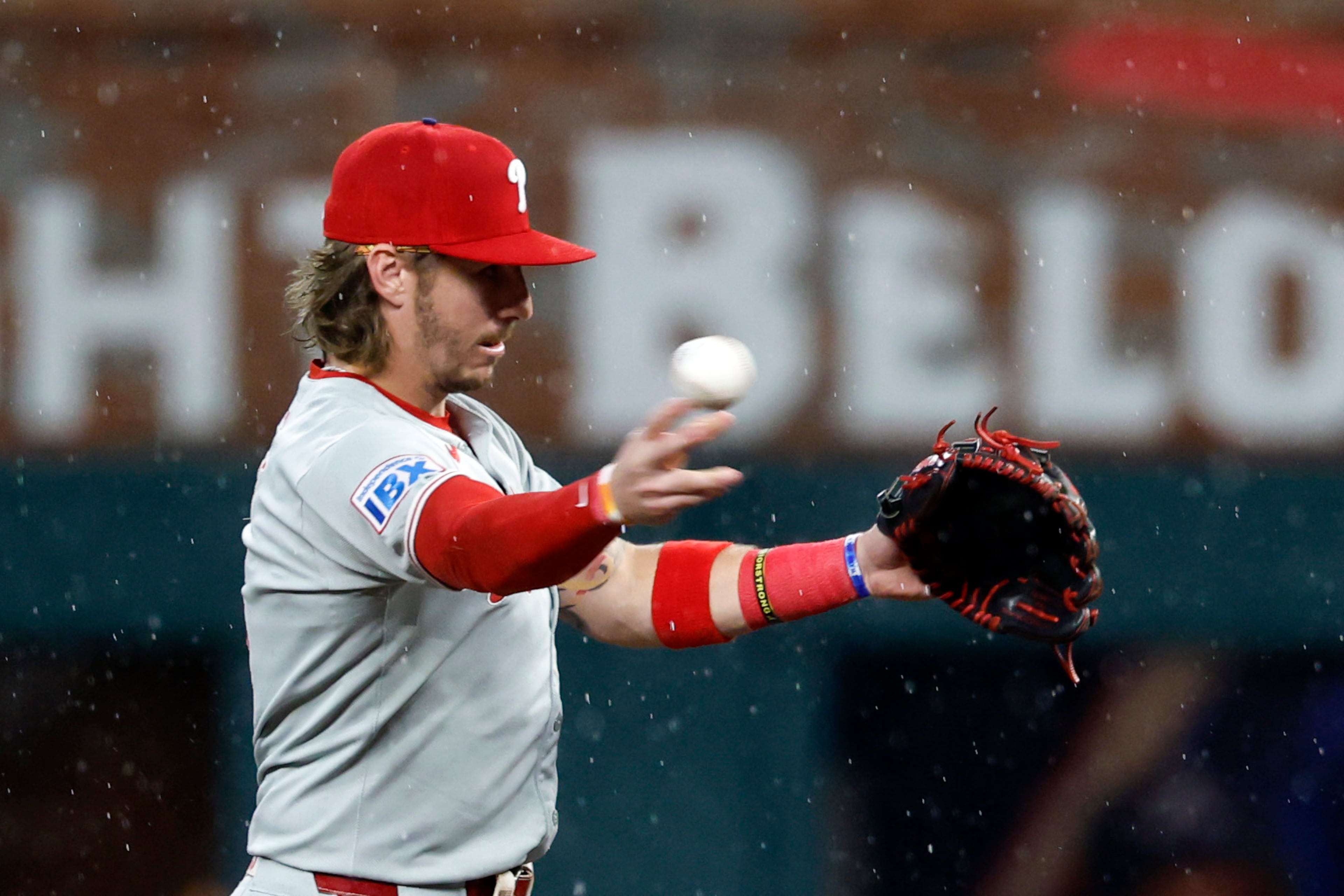 Phillies second baseman Bryson Stott throws to first for the out against the Braves' Ozzie Albies during the second inning Friday, June 27, 2025, in Atlanta. (Butch Dill/AP)