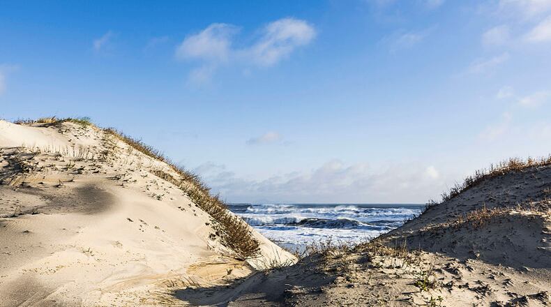 Dunes and ocean at Cape Hatteras National Seashore. (Photo by John Greim/LightRocket via Getty Images)